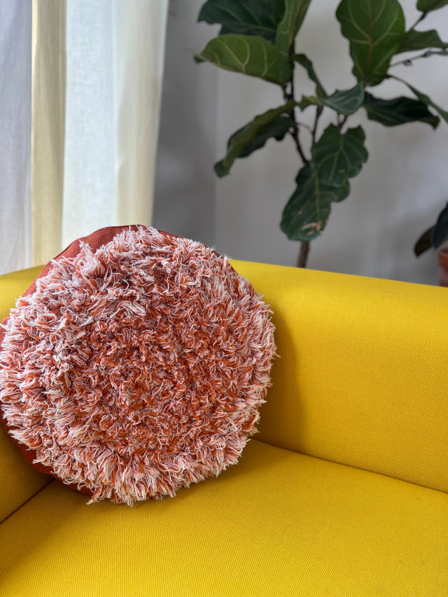 Salvage orange round cushion