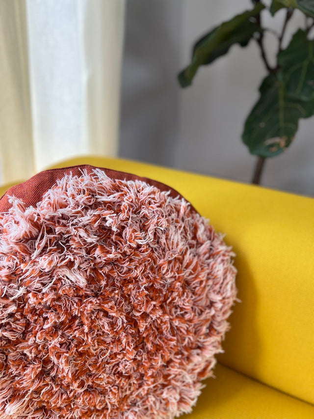 Salvage orange round cushion