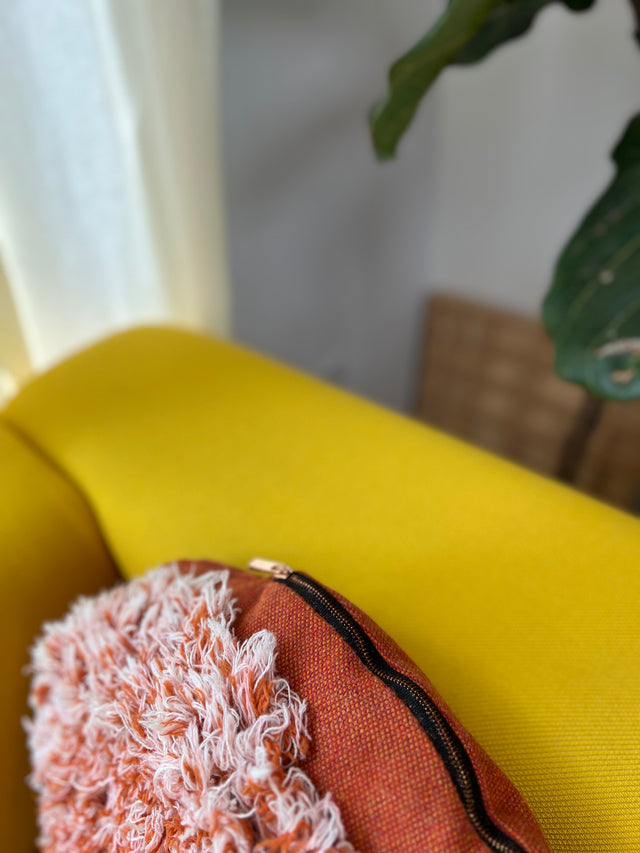 Salvage orange round cushion